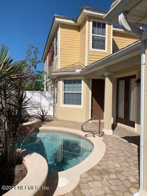 101 Hedgewood Drive St. Augustine, FL 32092 - Photo 22 of 27 a balcony with table and chairs