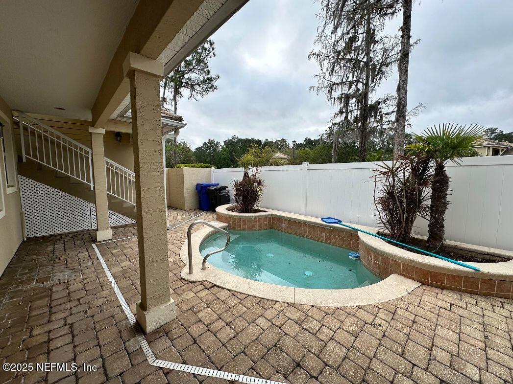101 Hedgewood Drive St. Augustine, FL 32092 - Photo 23 of 27 a view of a swimming pool with a chair