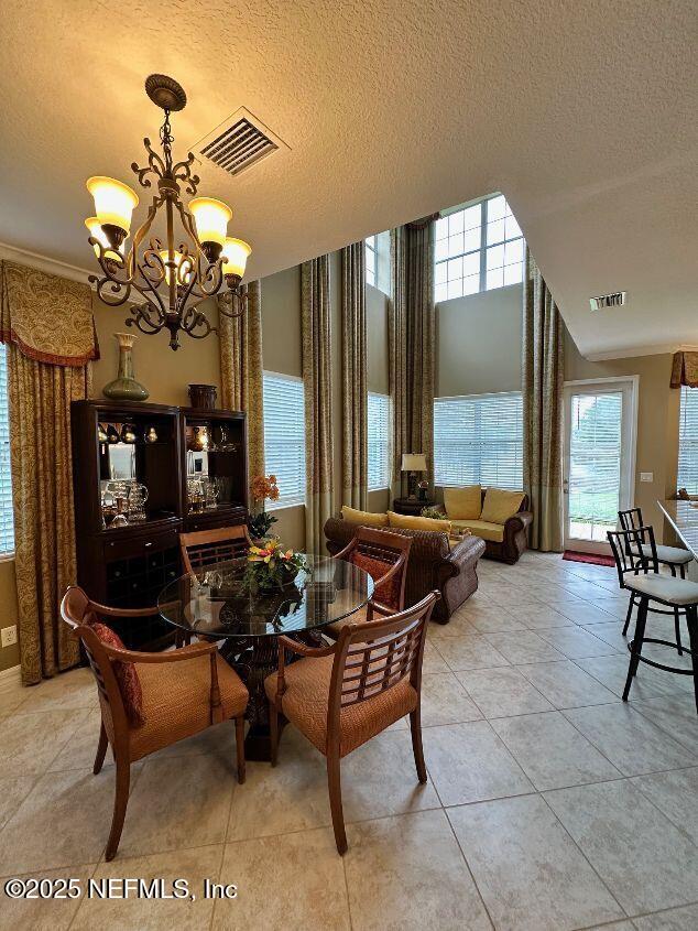 101 Hedgewood Drive St. Augustine, FL 32092 - Photo 3 of 27 a living room with patio furniture and a chandelier