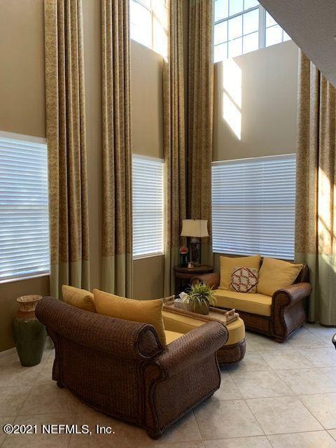 101 Hedgewood Drive St. Augustine, FL 32092 - Photo 5 of 27 a living room with furniture and a large window