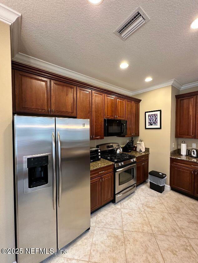 101 Hedgewood Drive St. Augustine, FL 32092 - Photo 6 of 27 a kitchen with stainless steel appliances granite countertop a refrigerator stove and sink