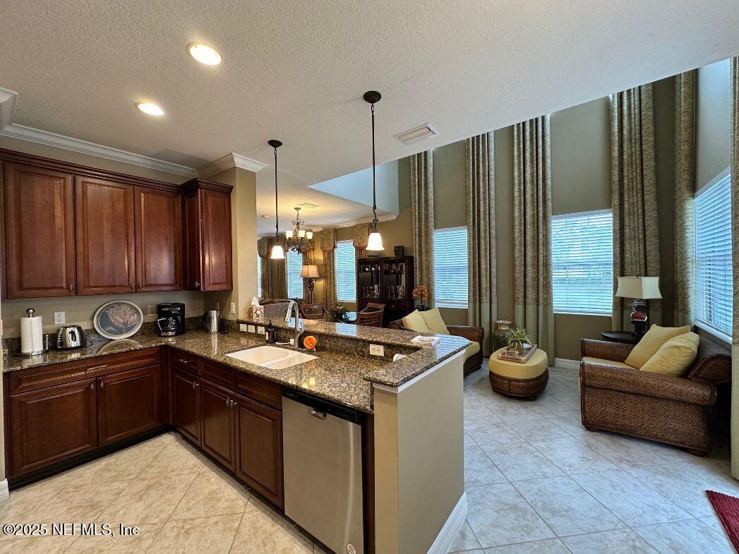 101 Hedgewood Drive St. Augustine, FL 32092 - Photo 7 of 27 a kitchen that has a sink and a wooden cabinets