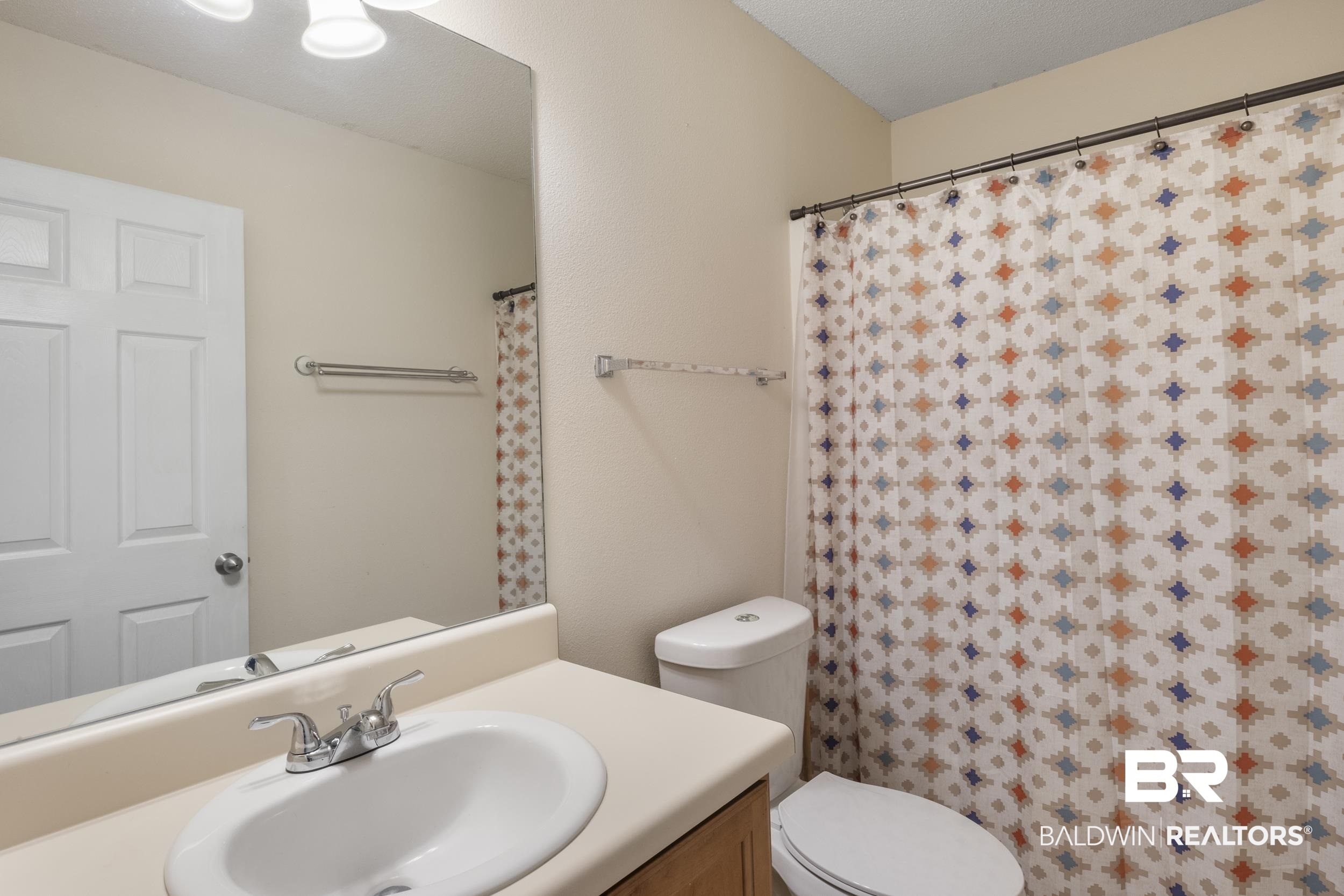 9610 Watkins Drive Fairhope, AL 36532 - Photo 14 of 26 Bathroom featuring toilet and vanity