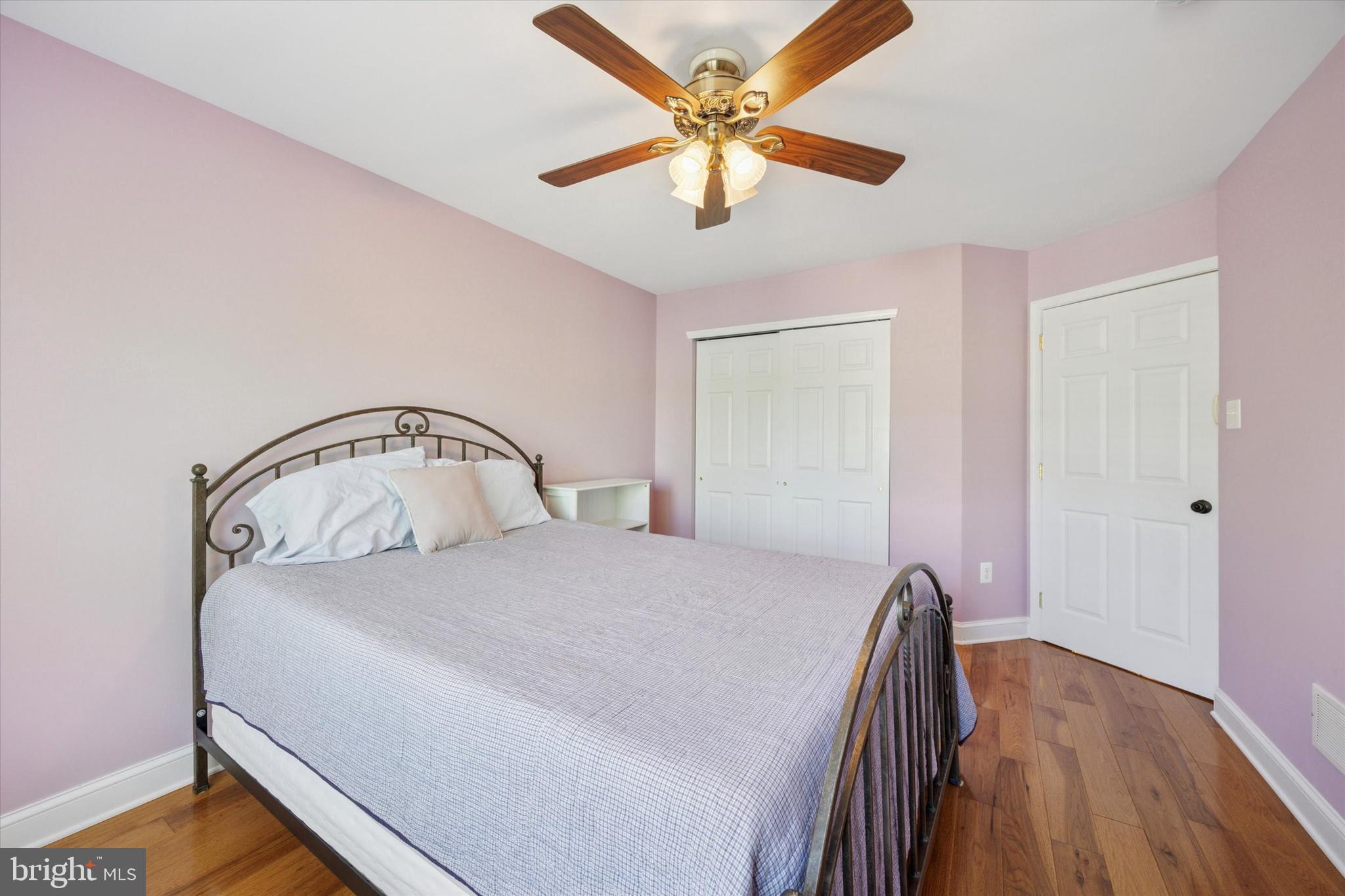 11 Weaver Drive Marlton, NJ 08053 - Photo 25 of 35 a bedroom with a bed and a chandelier