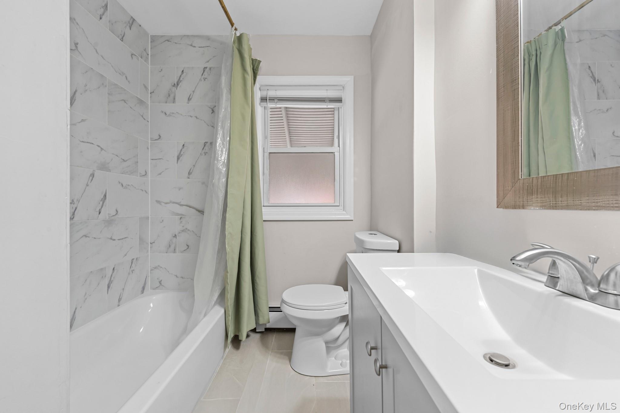 20 Dewitt Street Valley Stream, NY 11580 - Photo 7 of 13 a bathroom with a sink toilet and shower