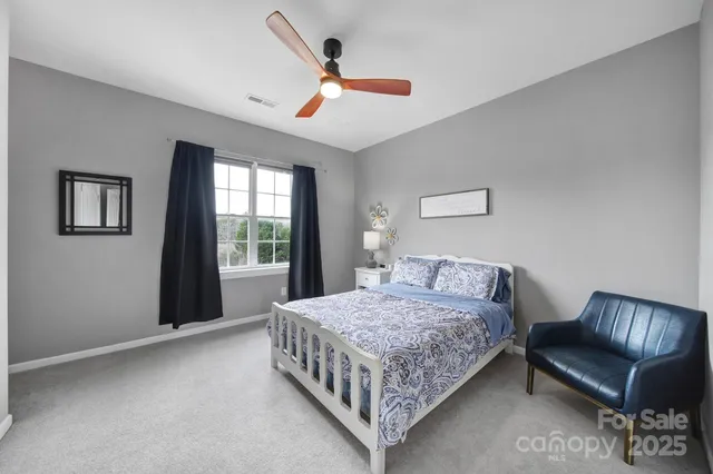 a bedroom with a bed furniture and a window