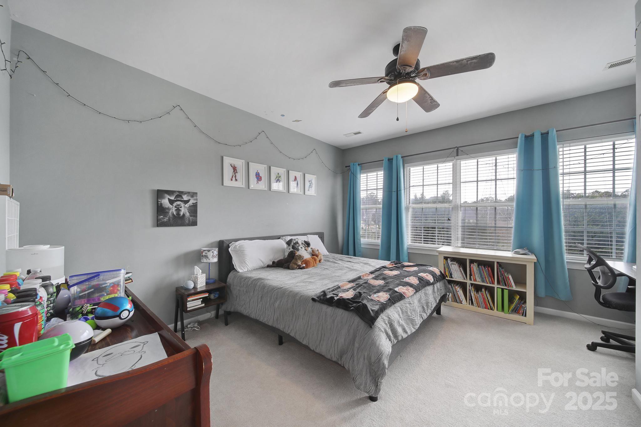 1002 Dataw Lane Indian Trail, NC 28079 - Photo 21 of 36 a bedroom with a bed furniture and a window