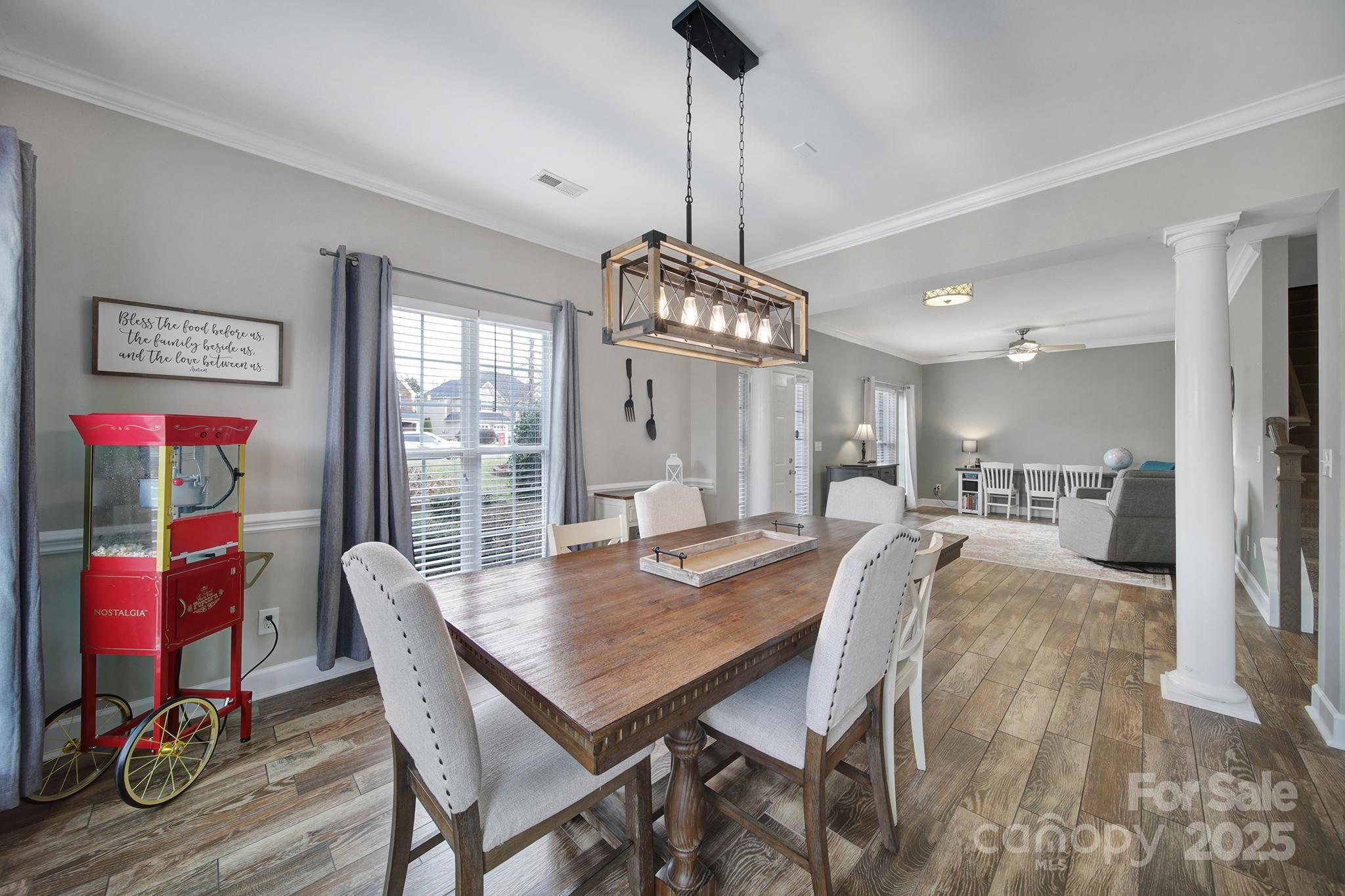 1002 Dataw Lane Indian Trail, NC 28079 - Photo 3 of 36 a view of a dining room with furniture window and wooden floor