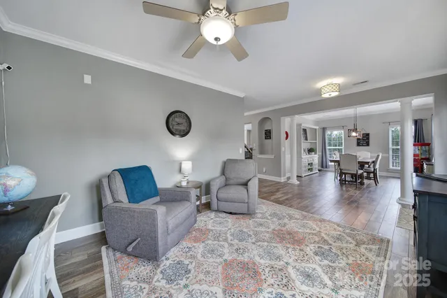 a living room with furniture and a table