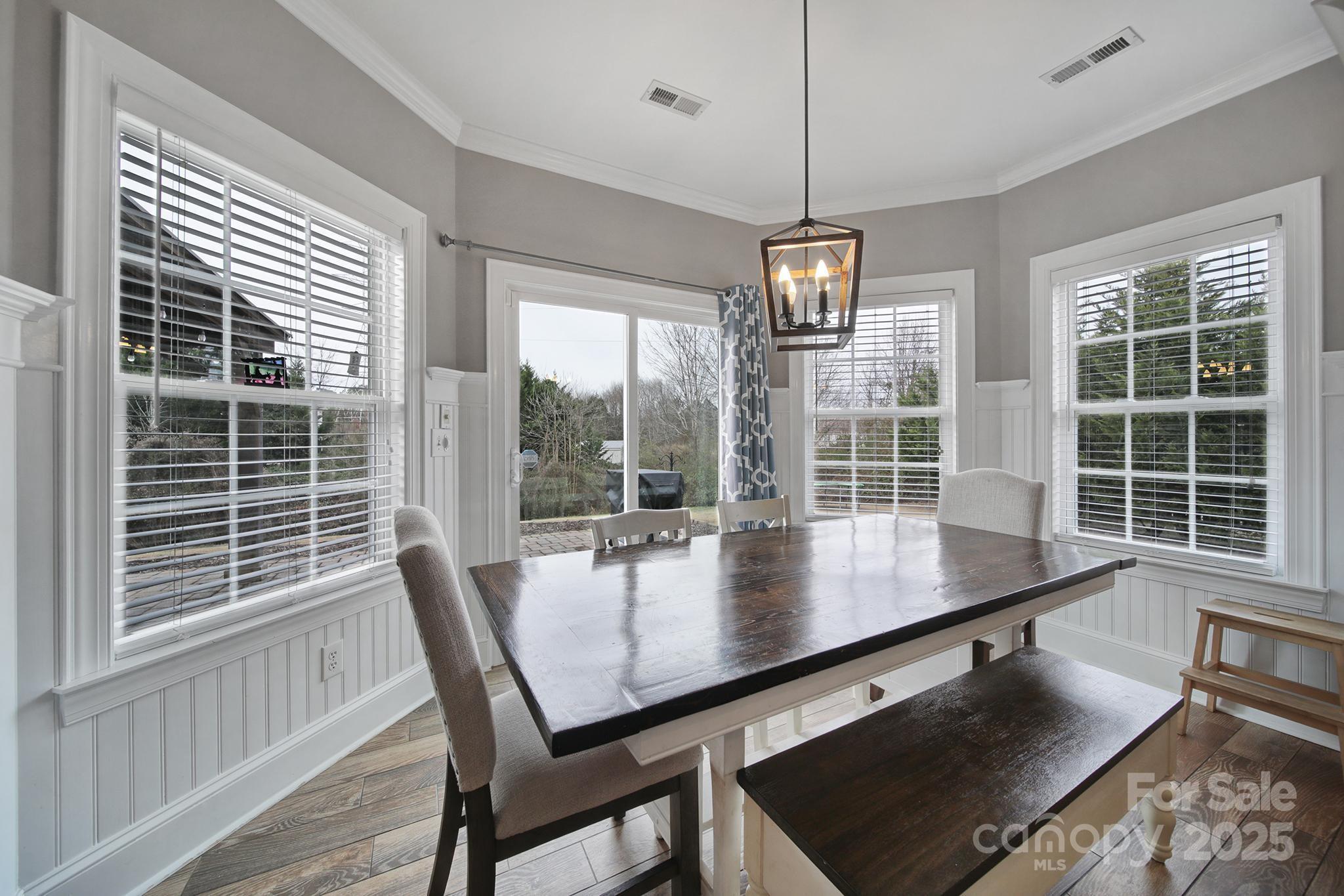1002 Dataw Lane Indian Trail, NC 28079 - Photo 9 of 36 a view of a dining room with furniture window and outside view
