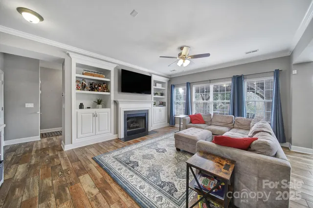 a living room with furniture or flat screen tv and a fireplace
