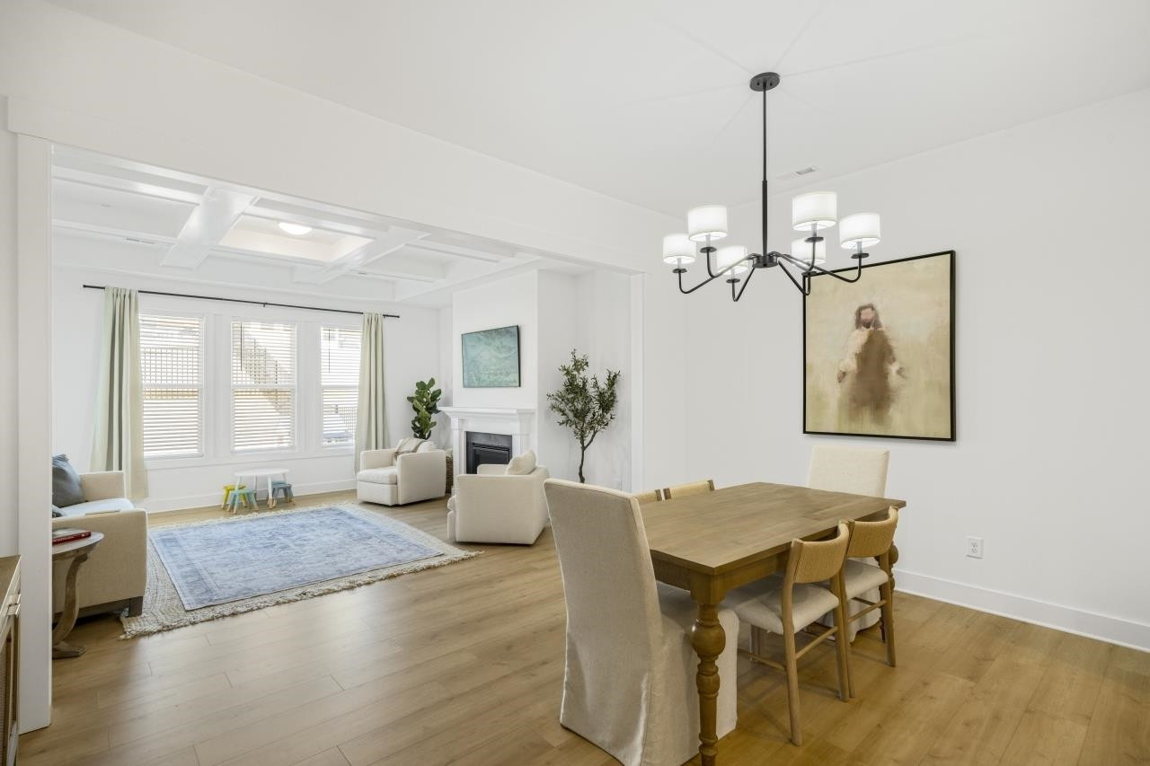 1001 Micato Way Wake Forest, NC 27587 - Photo 13 of 34 a view of a dining room with furniture window and wooden floor