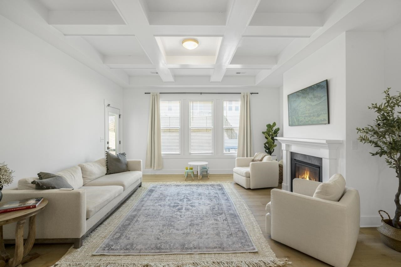 1001 Micato Way Wake Forest, NC 27587 - Photo 15 of 34 a living room with furniture and a fireplace