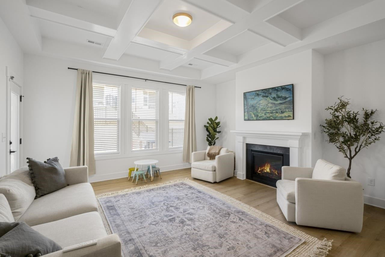 1001 Micato Way Wake Forest, NC 27587 - Photo 17 of 34 a living room with furniture and a fireplace