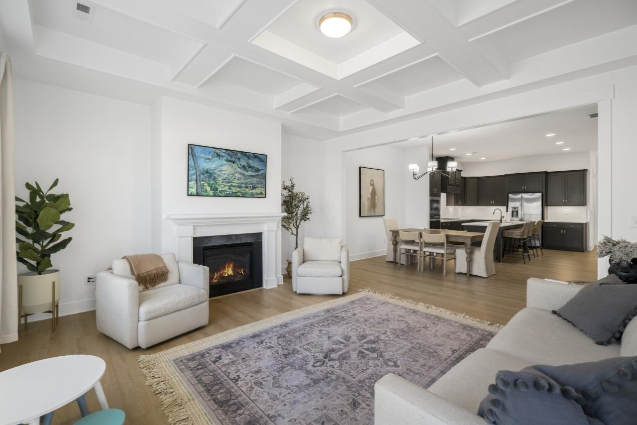 1001 Micato Way Wake Forest, NC 27587 - Photo 18 of 34 a living room with furniture and a fireplace