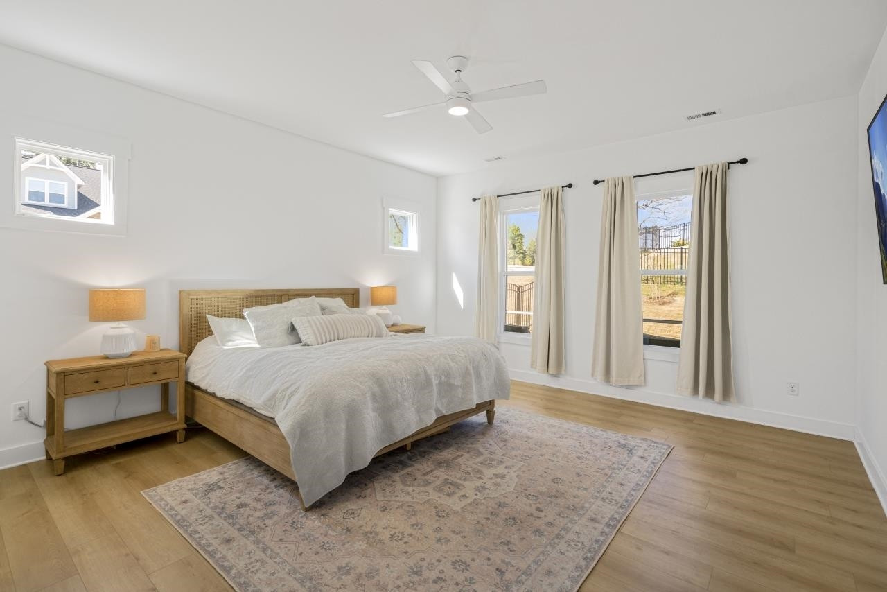 1001 Micato Way Wake Forest, NC 27587 - Photo 20 of 34 a spacious bedroom with a bed and a couch