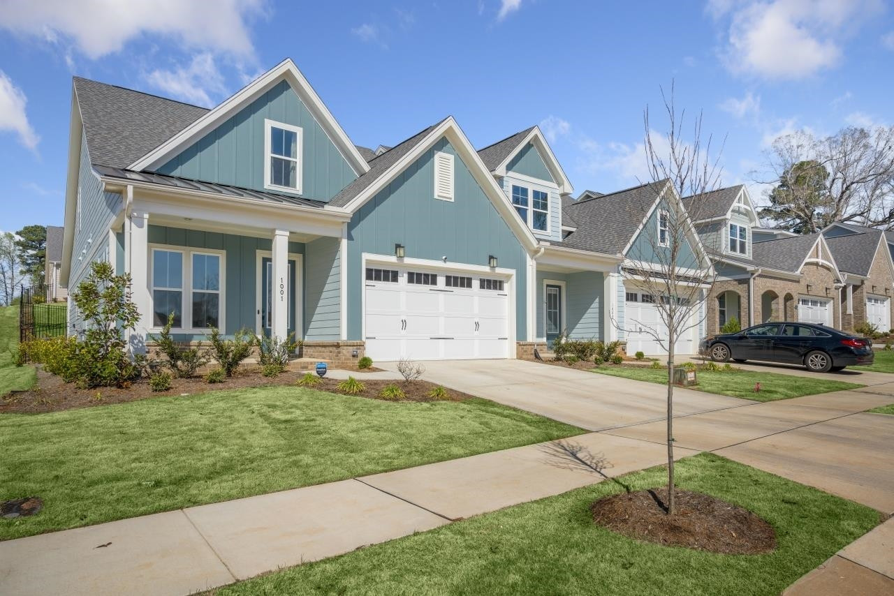 1001 Micato Way Wake Forest, NC 27587 - Photo 2 of 34 a front view of a house with a yard