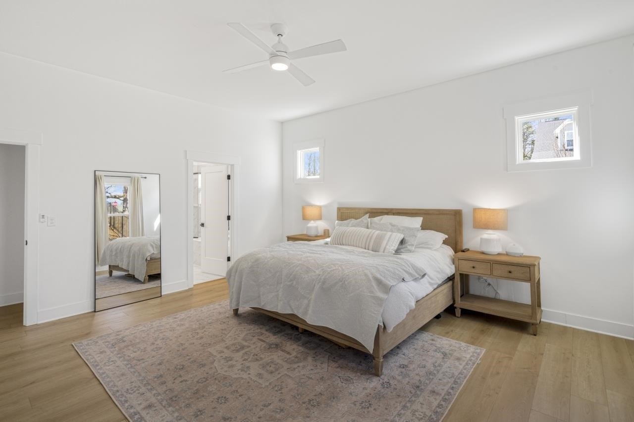 1001 Micato Way Wake Forest, NC 27587 - Photo 21 of 34 a spacious bedroom with a bed and cabinet