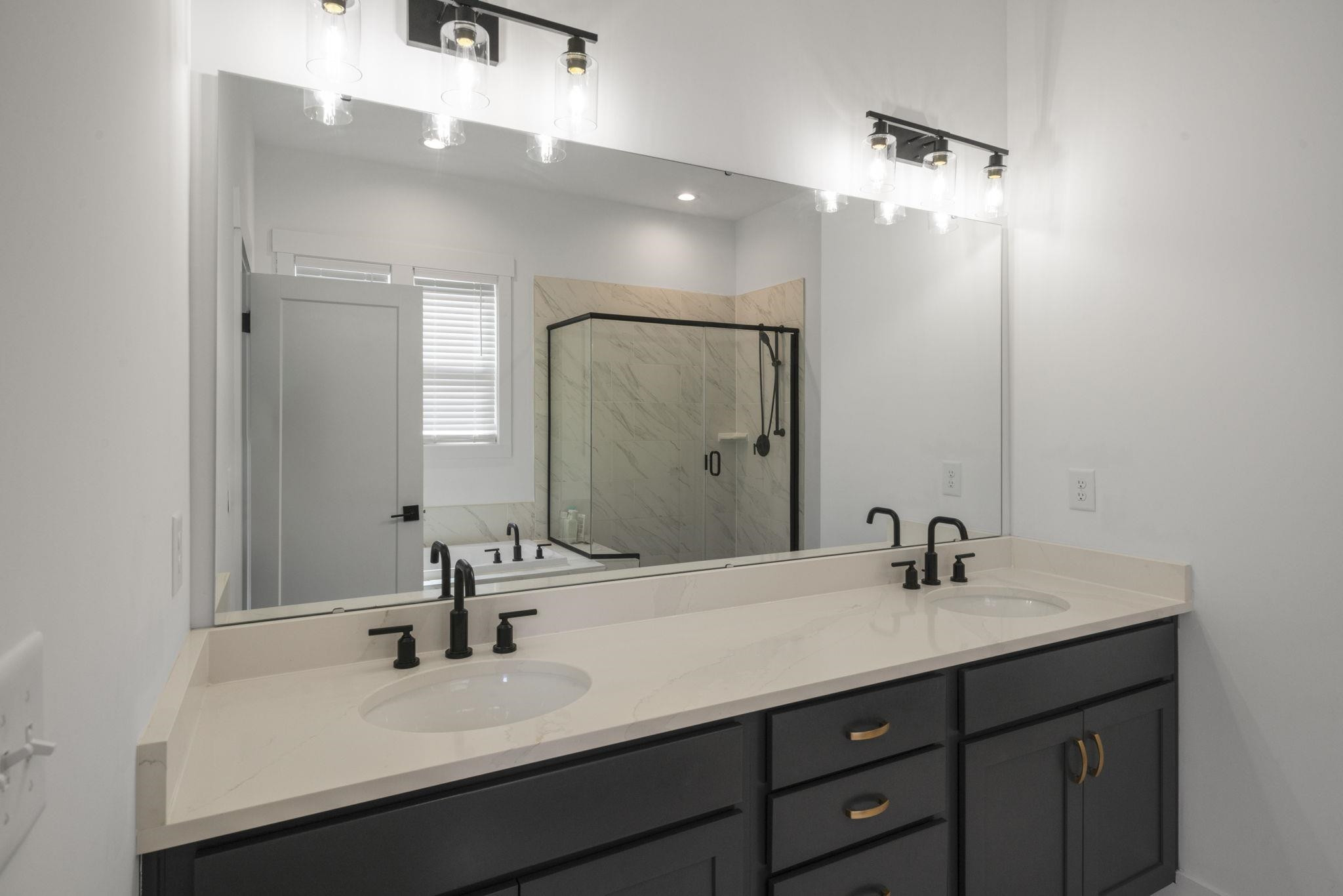 1001 Micato Way Wake Forest, NC 27587 - Photo 22 of 34 a bathroom with a double vanity sink and a mirror