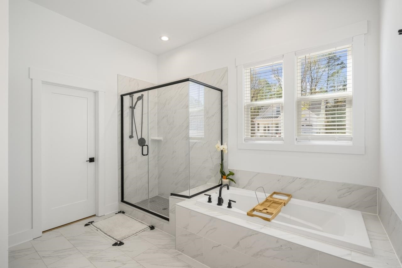 1001 Micato Way Wake Forest, NC 27587 - Photo 24 of 34 a bathroom with a tub a sink and a window