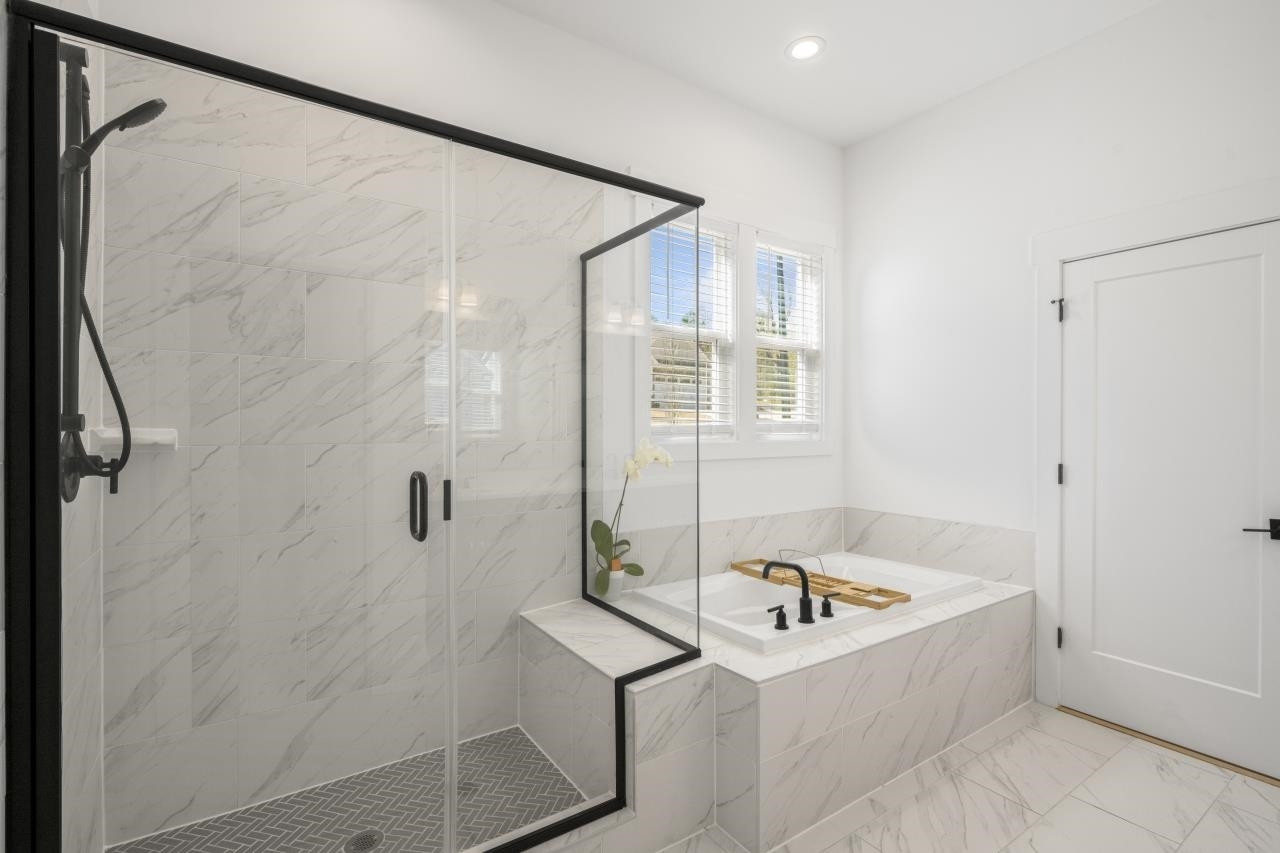 1001 Micato Way Wake Forest, NC 27587 - Photo 25 of 34 a bathroom with a tub and a shower