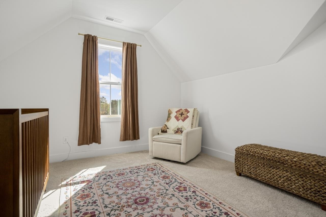 1001 Micato Way Wake Forest, NC 27587 - Photo 27 of 34 a bedroom with furniture and a window
