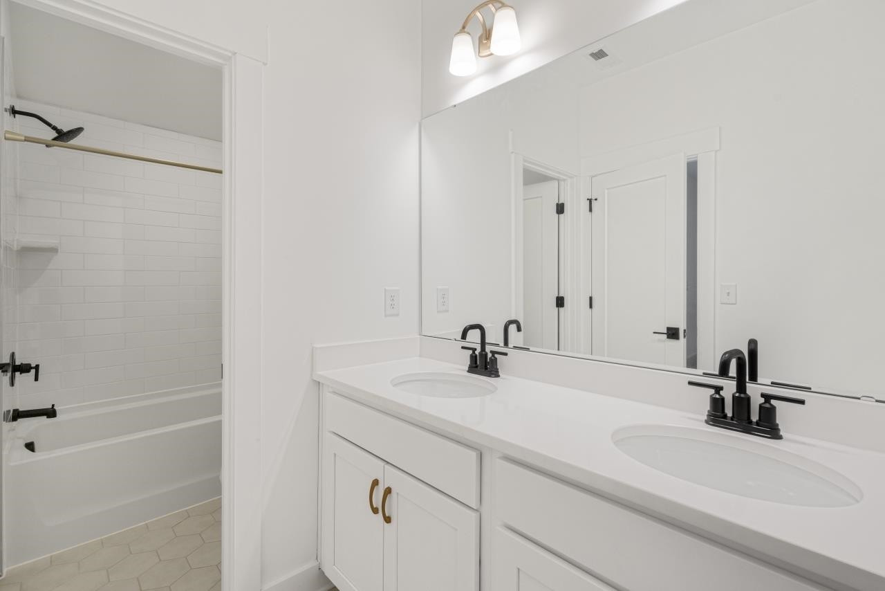 1001 Micato Way Wake Forest, NC 27587 - Photo 28 of 34 a bathroom with a sink and a mirror
