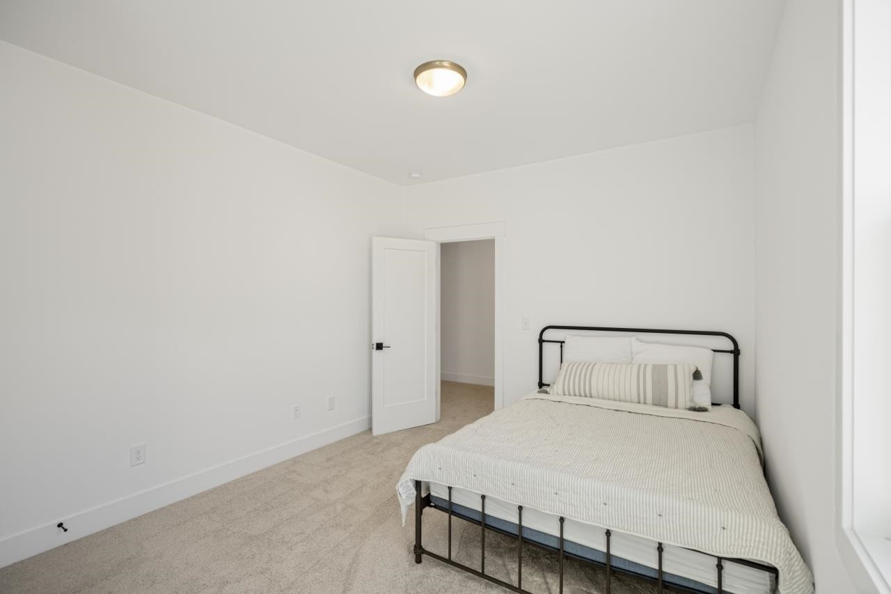 1001 Micato Way Wake Forest, NC 27587 - Photo 29 of 34 a bedroom with a bed and a window