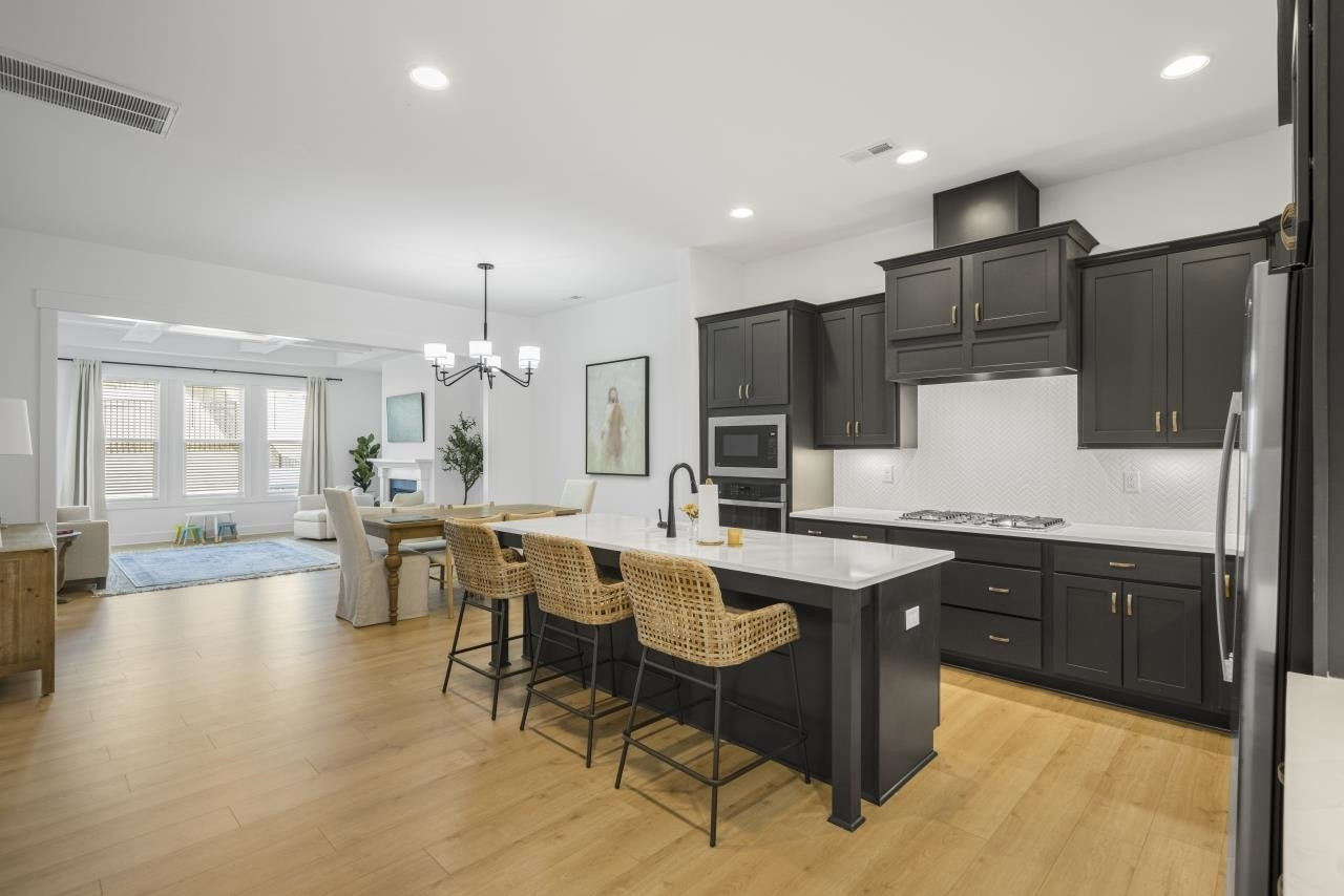 1001 Micato Way Wake Forest, NC 27587 - Photo 9 of 34 a kitchen with lots of counter top space and appliances