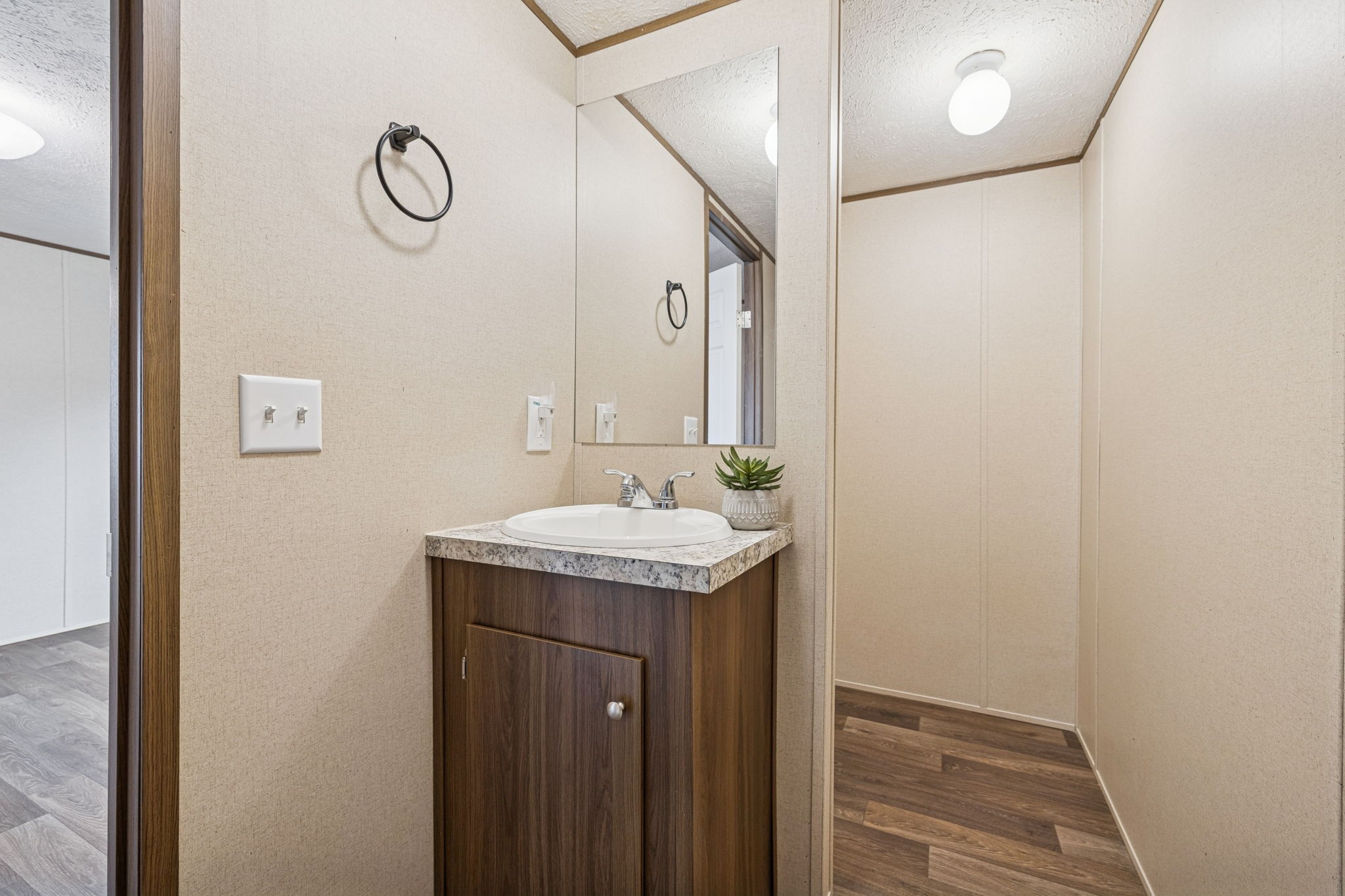 108 Lyell Road Hohenwald, TN 38462 - Photo 12 of 28 a bathroom with a granite countertop sink and a mirror