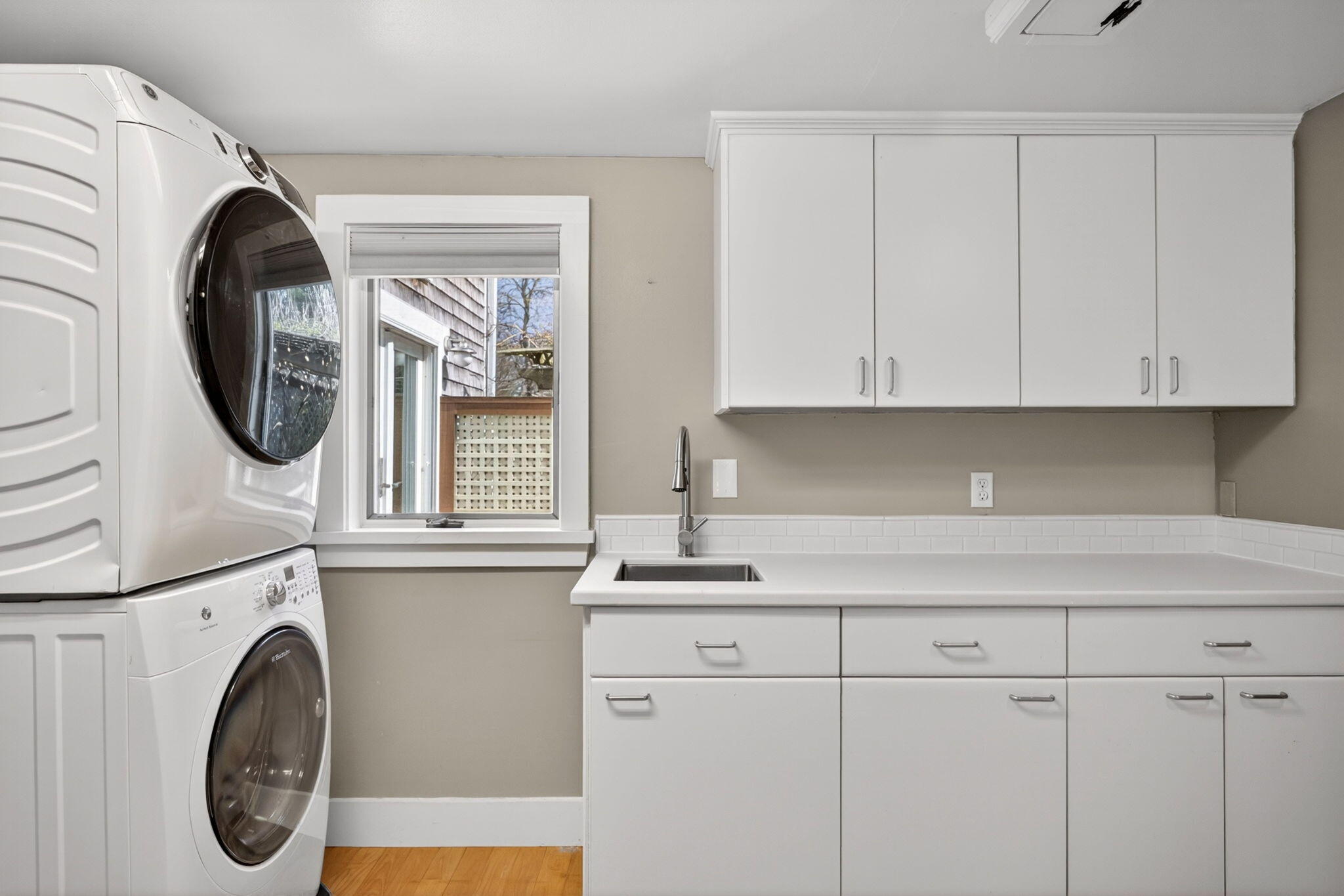 69 County Road Bourne, MA 02532 - Photo 22 of 54 a kitchen with a sink and a washer dryer