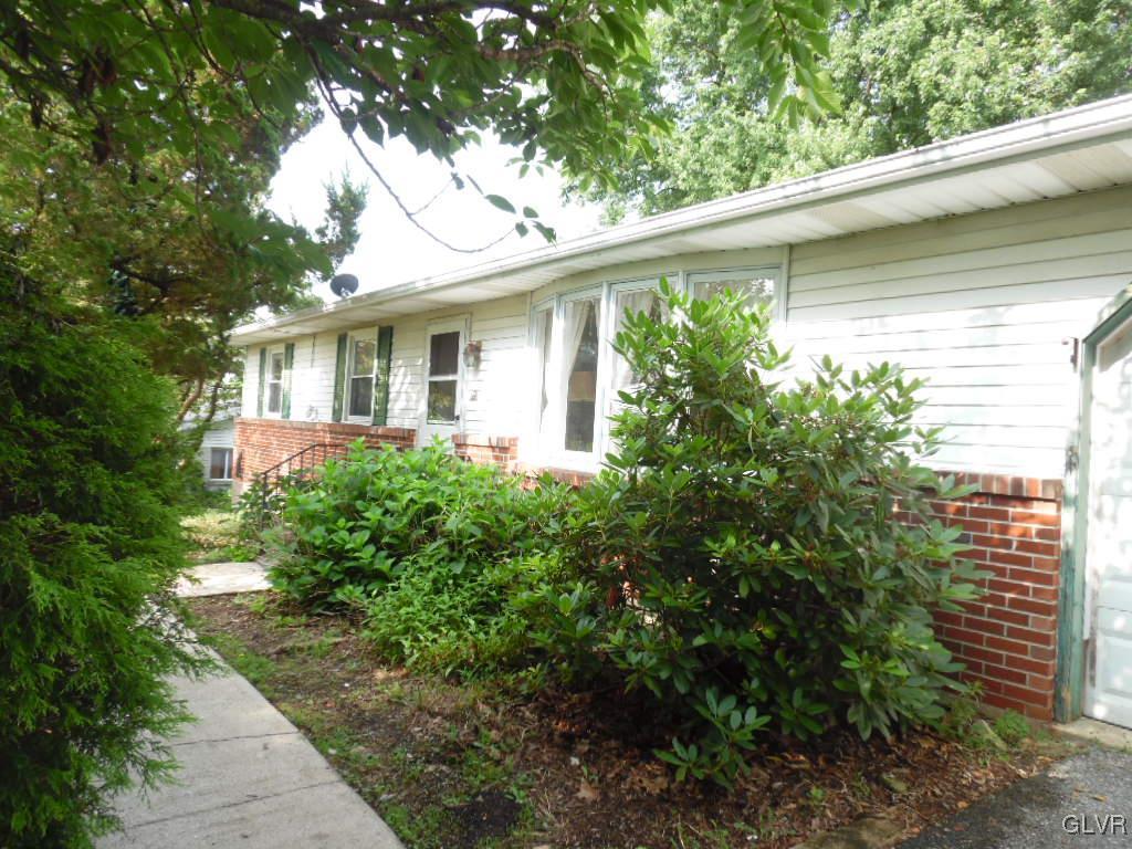 Brick and vinyl siding front view of this lovely r