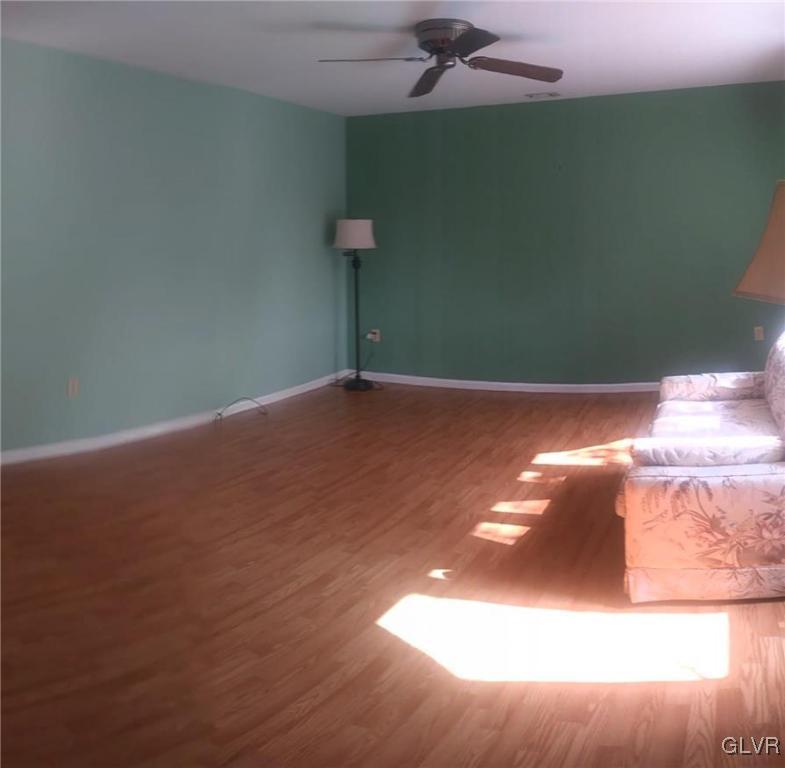 Beautiful flooring and paint in living room with l