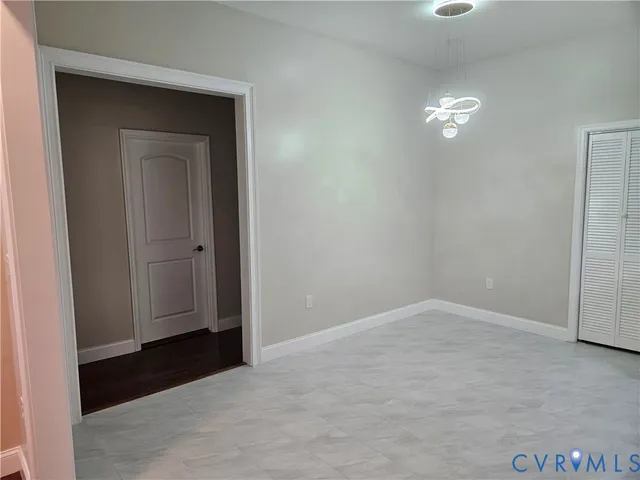 an empty room with closet area