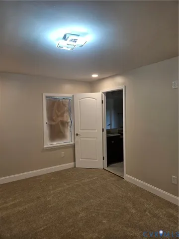 a bathroom with a granite countertop sink toilet a mirror and shower