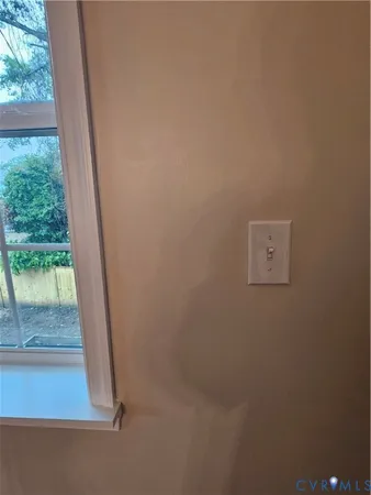 a view of a garage with wooden floor