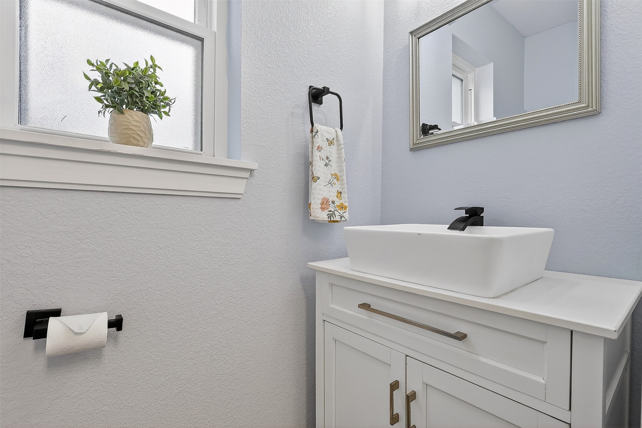 17106 Spring Creek Forest Drive Spring, TX 77379 - Photo 14 of 49 Stylish first-floor half bath perfectly positioned for guests and everyday convenience.