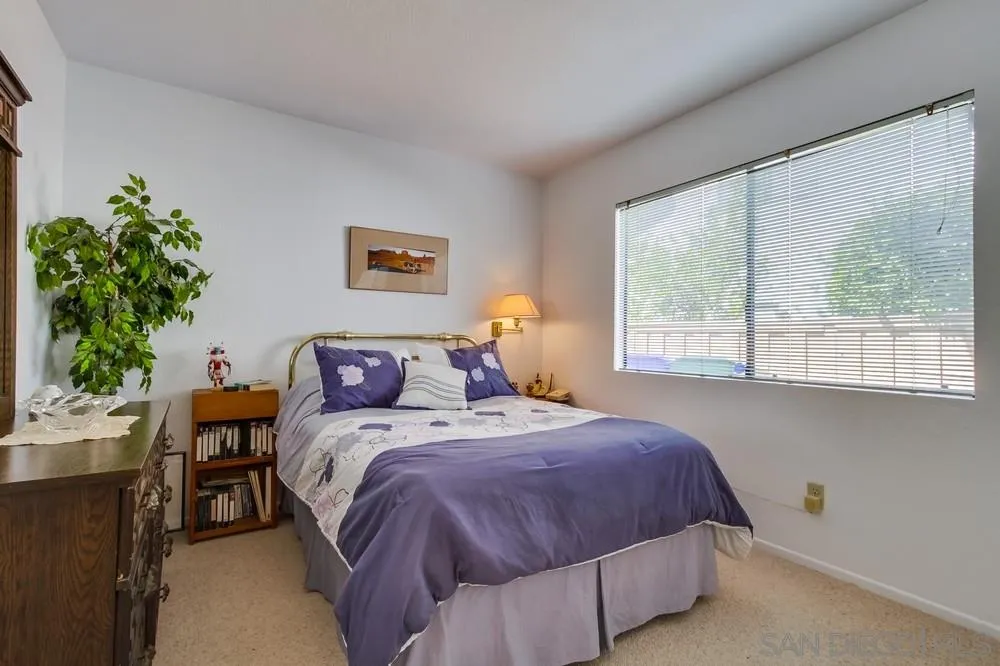 13354 Benchley Road San Diego, CA 92130 - Photo 12 of 24 a bedroom with a bed and a window
