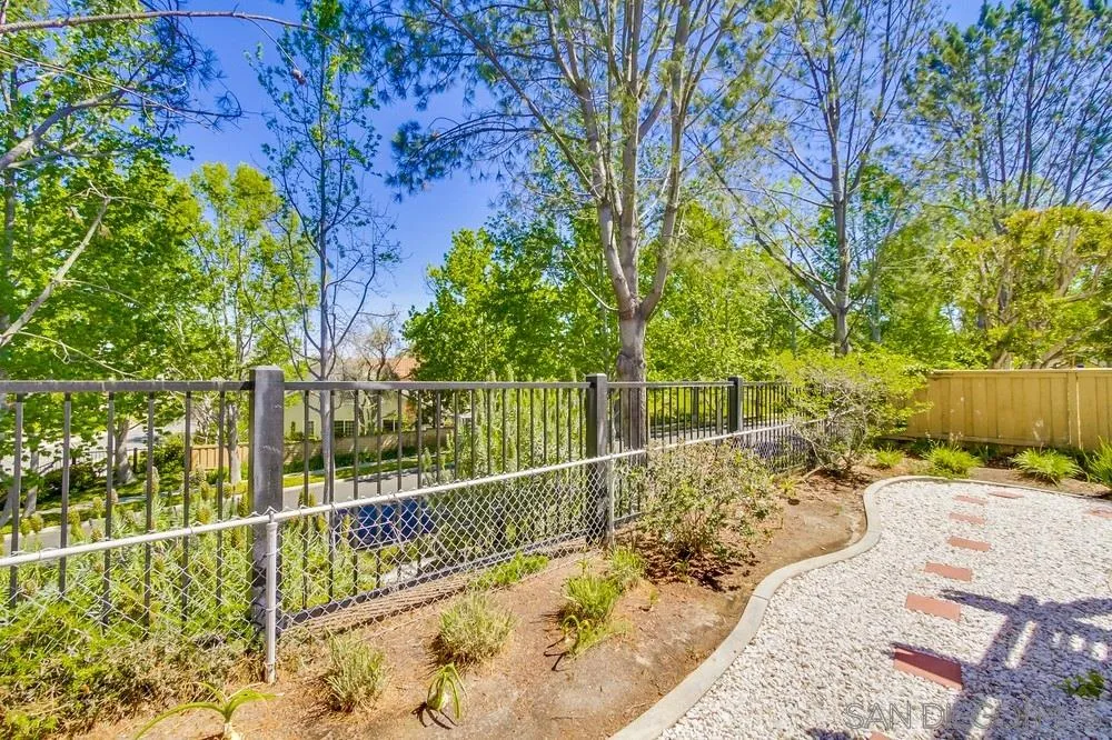 13354 Benchley Road San Diego, CA 92130 - Photo 23 of 24 a view of a wrought iron fences with large trees
