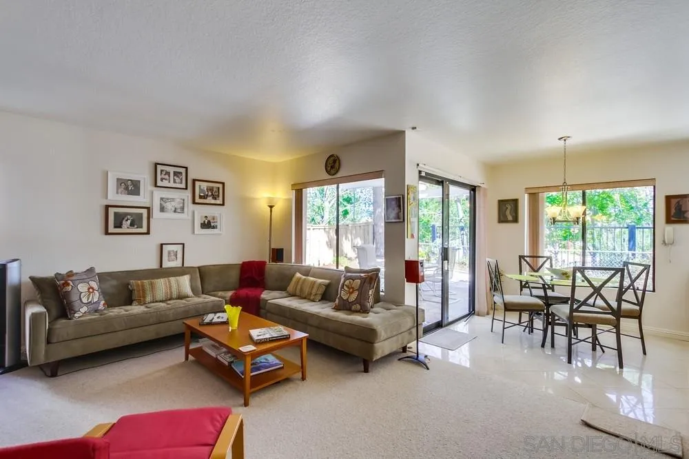 13354 Benchley Road San Diego, CA 92130 - Photo 4 of 24 a living room with furniture and large windows