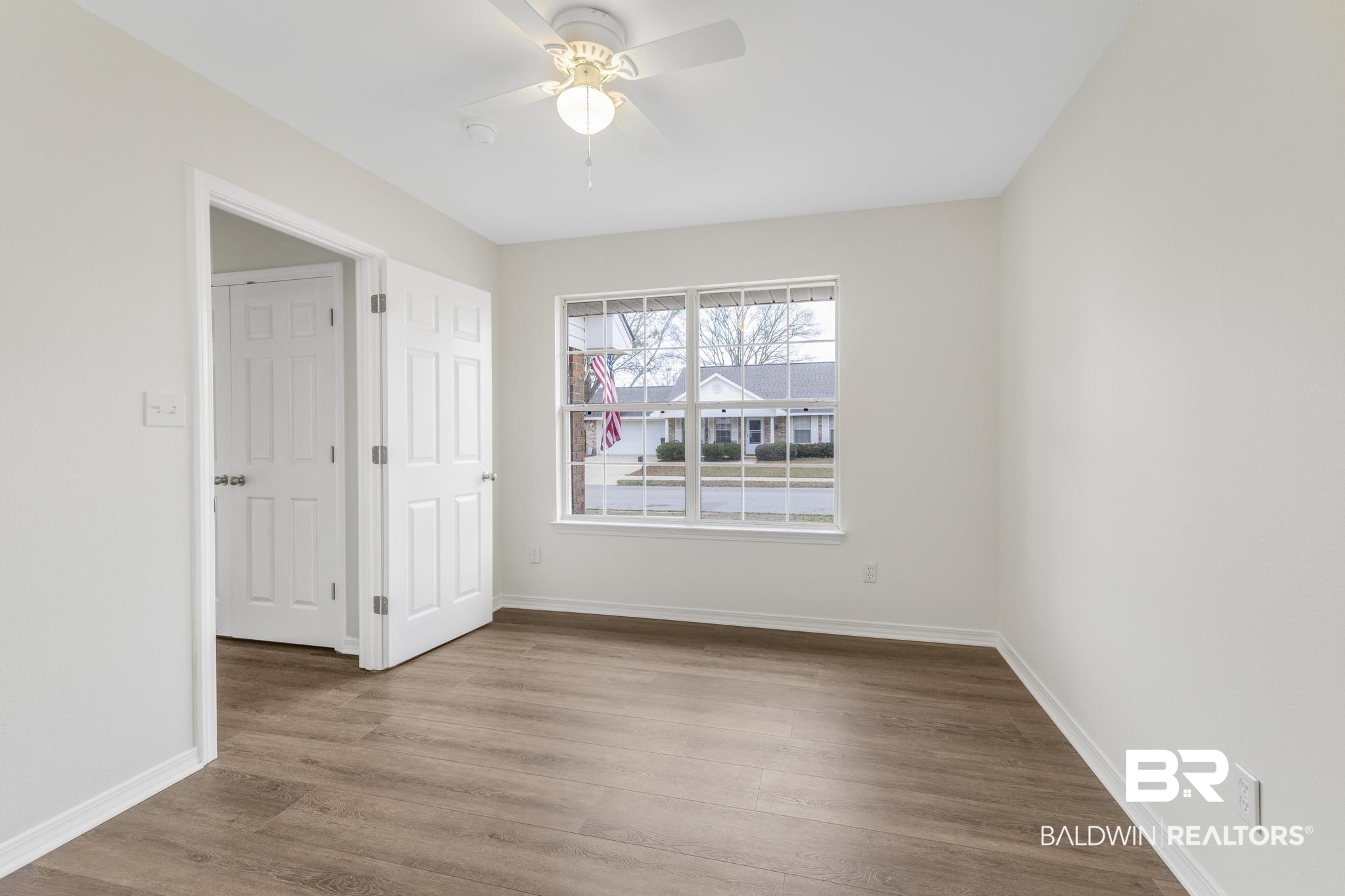 16330 Absalom Street Foley, AL 36535 - Photo 28 of 42 Empty room with ceiling fan and light wood-type flooring