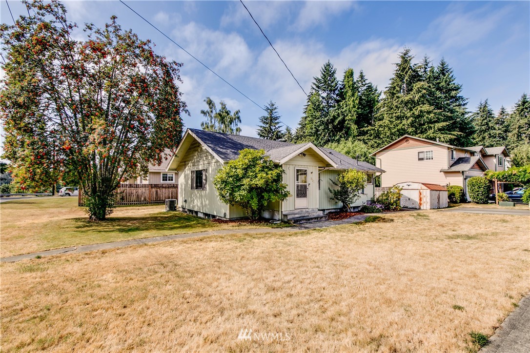 902 South Mullen Street Tacoma, WA 98405 - Photo 2 of 30 a front view of a house with a yard and garage