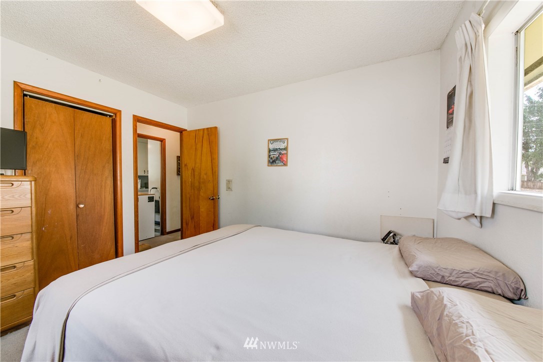 902 South Mullen Street Tacoma, WA 98405 - Photo 19 of 30 a bedroom with a large bed and a window