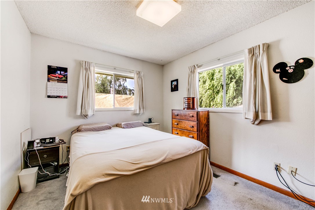 902 South Mullen Street Tacoma, WA 98405 - Photo 20 of 30 a bedroom with a bed and a window