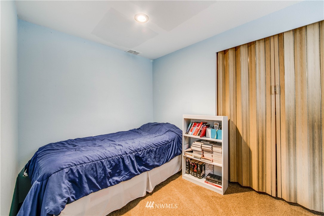 902 South Mullen Street Tacoma, WA 98405 - Photo 23 of 30 a bedroom with a bed and a window