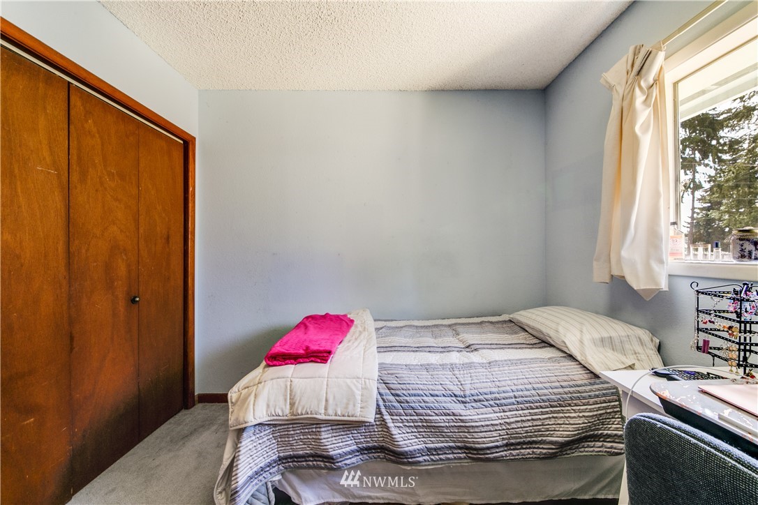 902 South Mullen Street Tacoma, WA 98405 - Photo 24 of 30 a bedroom with a bed and a window