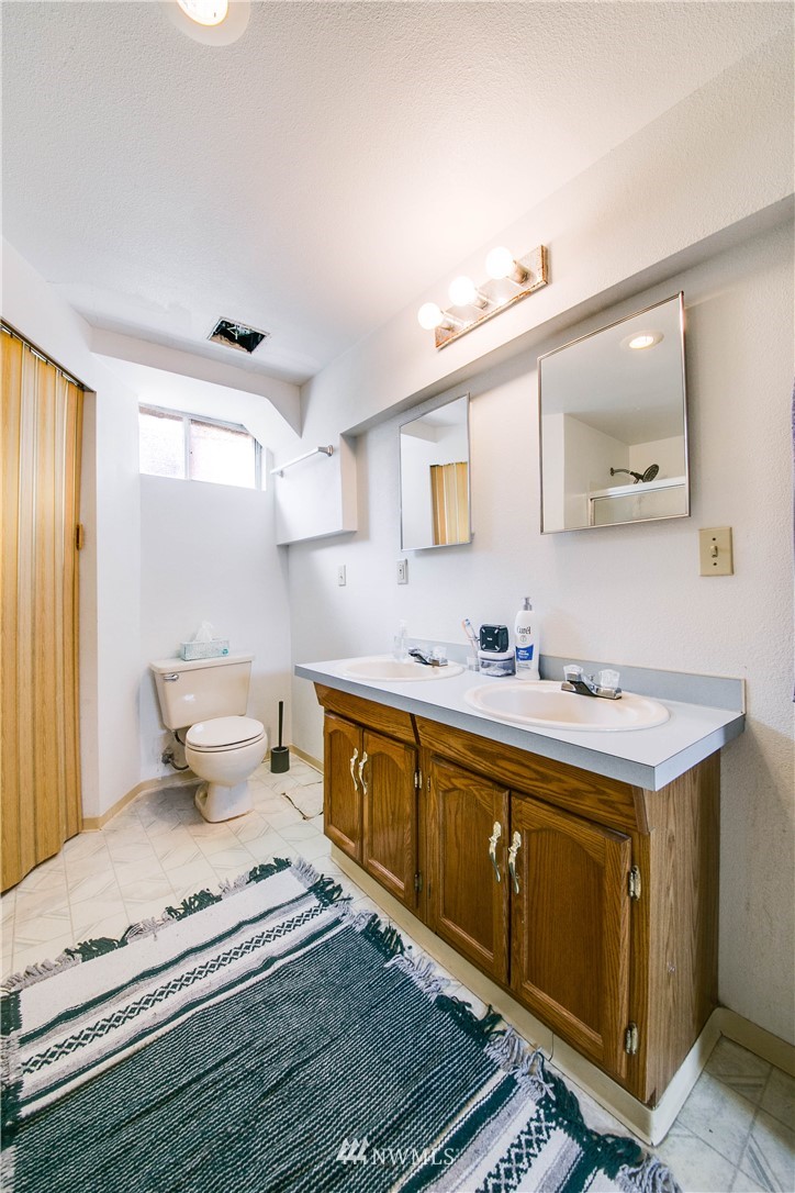 902 South Mullen Street Tacoma, WA 98405 - Photo 26 of 30 a bathroom with a sink and a mirror