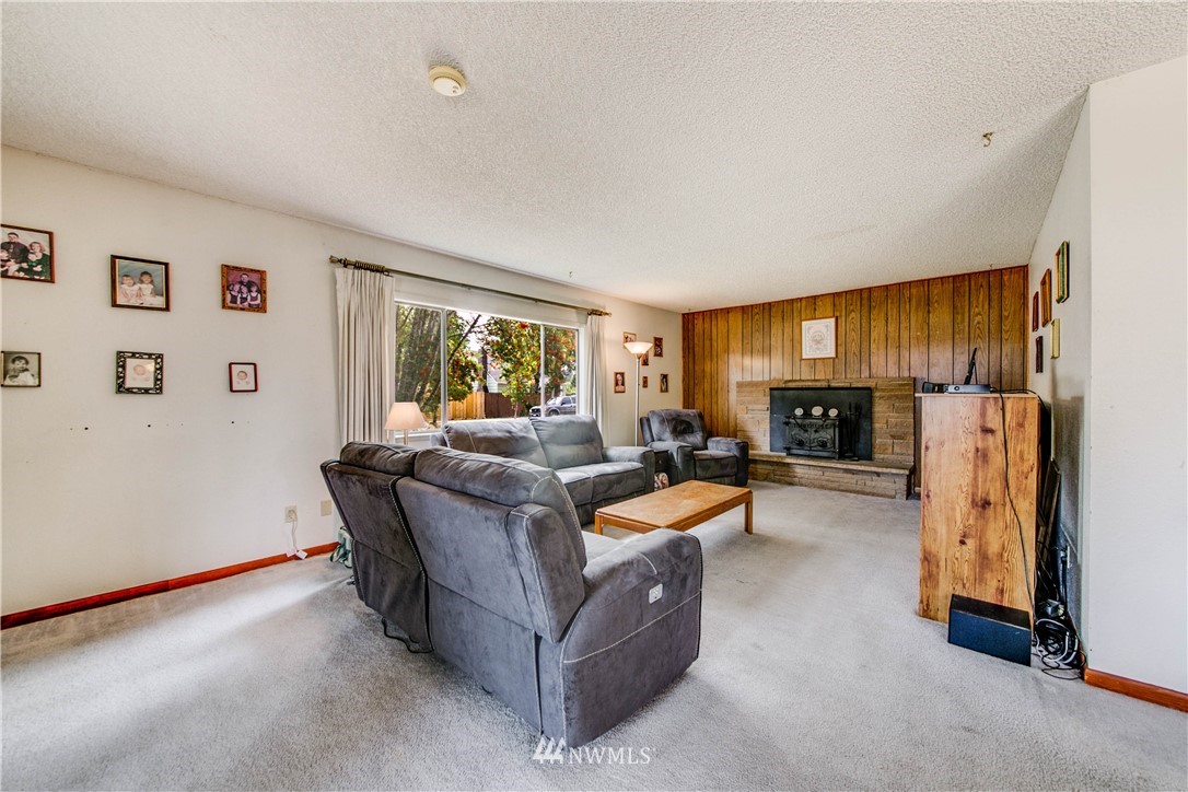902 South Mullen Street Tacoma, WA 98405 - Photo 10 of 30 a living room with furniture and a fireplace