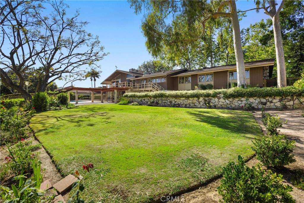 8780 Hillcrest Road Buena Park, CA 90621 - Photo 12 of 62 a front view of house with yard and green space