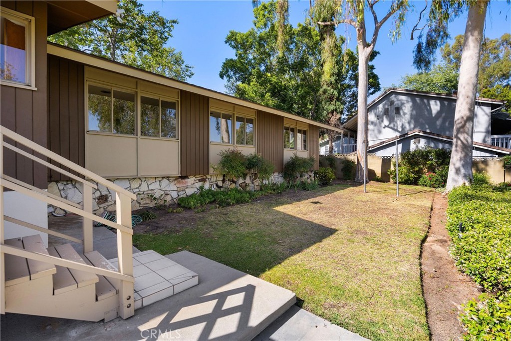 8780 Hillcrest Road Buena Park, CA 90621 - Photo 15 of 62 a view of a house with backyard and sitting area